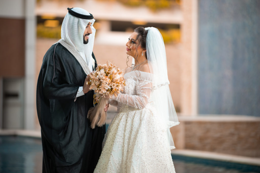 Bride and Groom near swimming pool