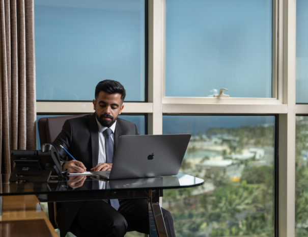 Man working in guest room